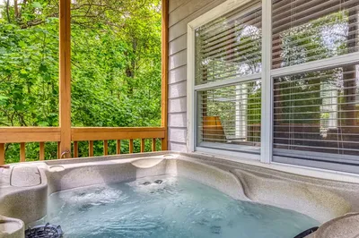 hot tub on porch of Gatlinburg cabin