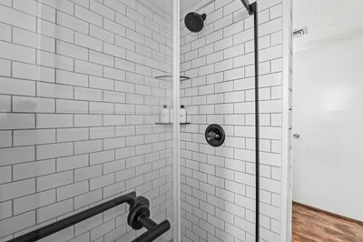 View of White Tiled Shower