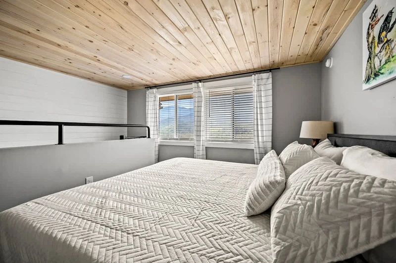 Loft bedroom layout, with stair access point and mountain view