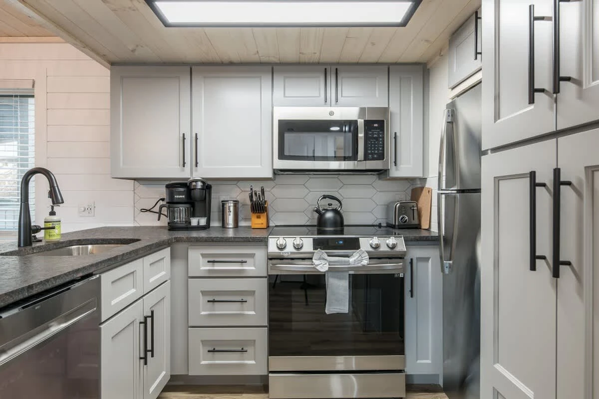 Full Kitchen View w/ Stainless Steel Appliances & Countertop Gadgets