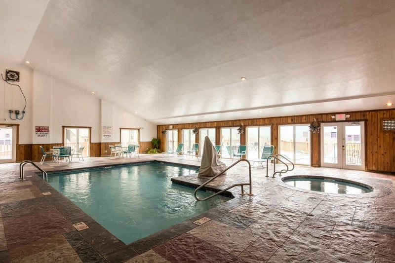 The indoor pool area includes a hot tub, steam room, and sauna.