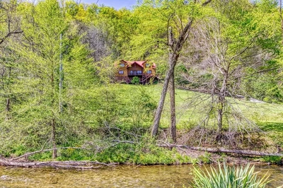 mystical creek pool lodge is one of our secluded Smoky Mountain cabins on the river