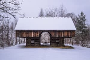 cantilever barn in cades cove covered in snow