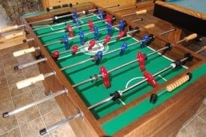Kids in Gatlinburg or Pigeon Forge cabins enjoy playing games like Foosball on vacation!