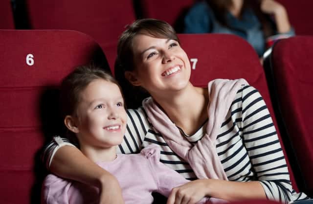 mother and daughter in a Pigeon Forge cabin with a movie theater room