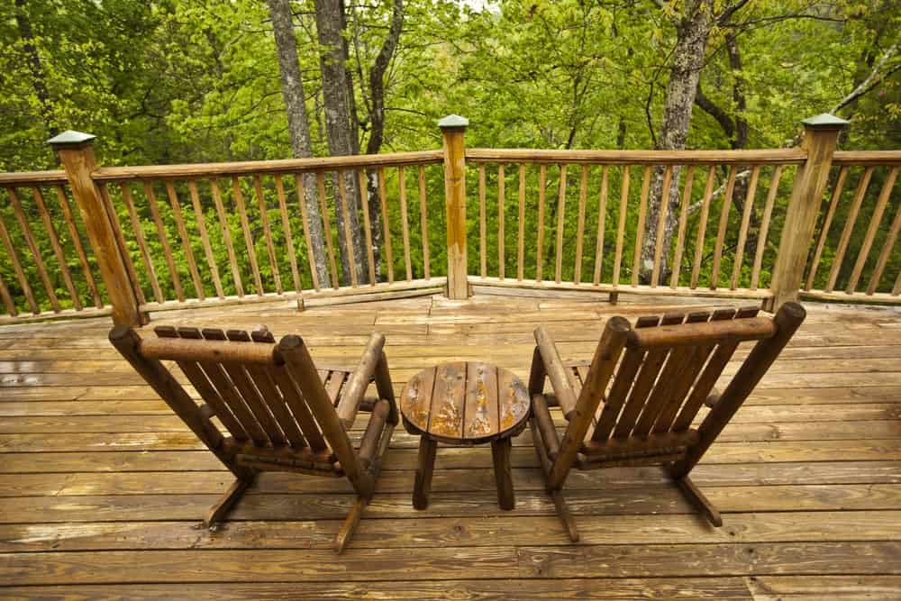 Two wooden chairs on the deck of a Pigeon Forge or Gatlinburg cabin in the Smoky Mountains