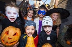 A group of kids dressed up for Halloween.