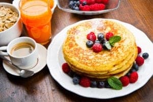 Tasty pancakes with other breakfast items.