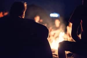People sitting around a fire pit.
