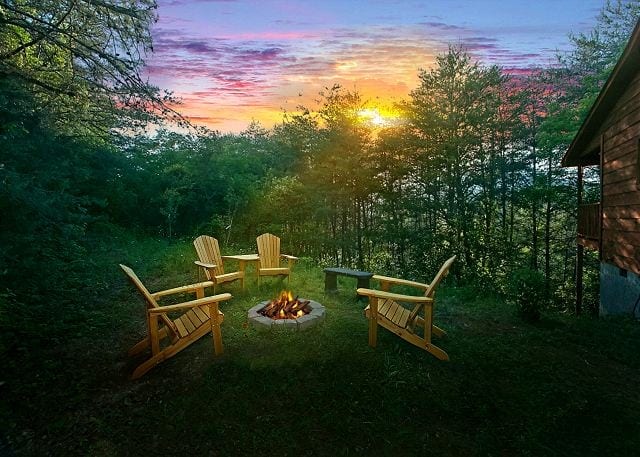 Sunset at a Gatlinburg cabin with a fire pit.