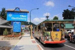 trolley outside of ober gatlinburg sign