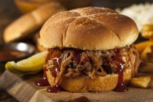 pulled pork sandwich covered in barbeque sauce
