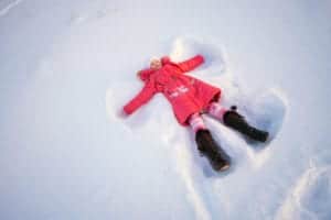 girl playing in snow at ober gatlinburg
