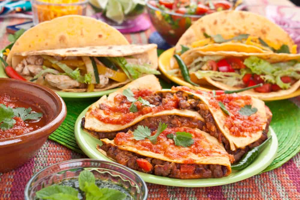 quesadillas and tacos with salsa at a mexican restaurant