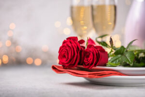 Valentine's Day table setting with roses and champagne